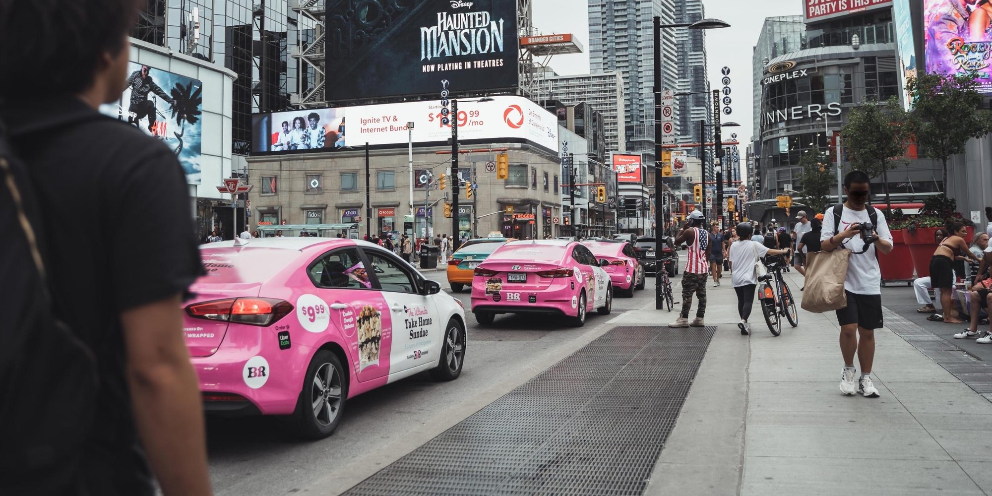 Baskin Robbins branded vehicles drive through Yonge & Dundas